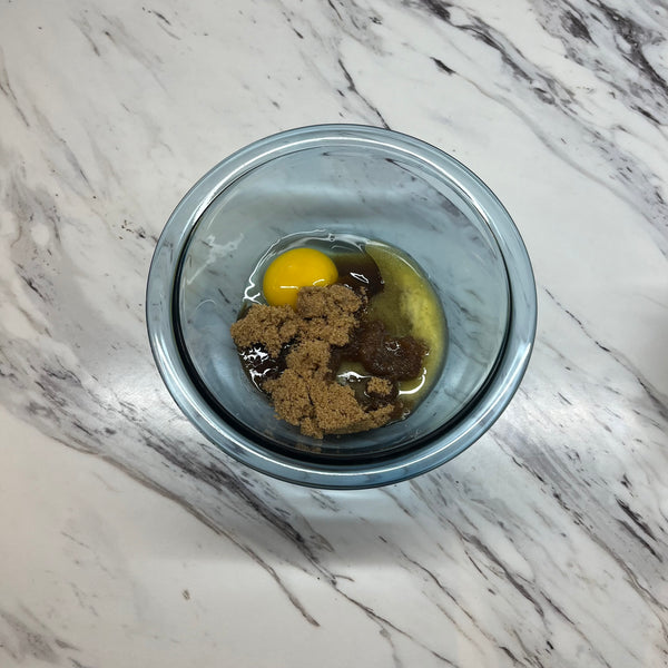 adding the wet ingredients to another bowl