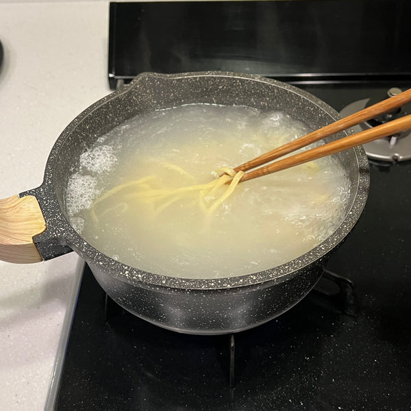 boiling the noodles til al dente